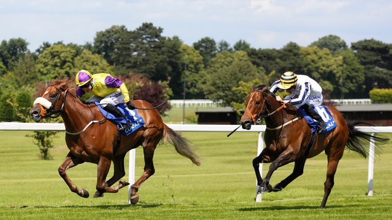 Brando ridden by Tom Eaves (left) leads Monsieur Joe ridden by Adam Kirby home to win the Coral Charge during Coral-Eclipse Day.