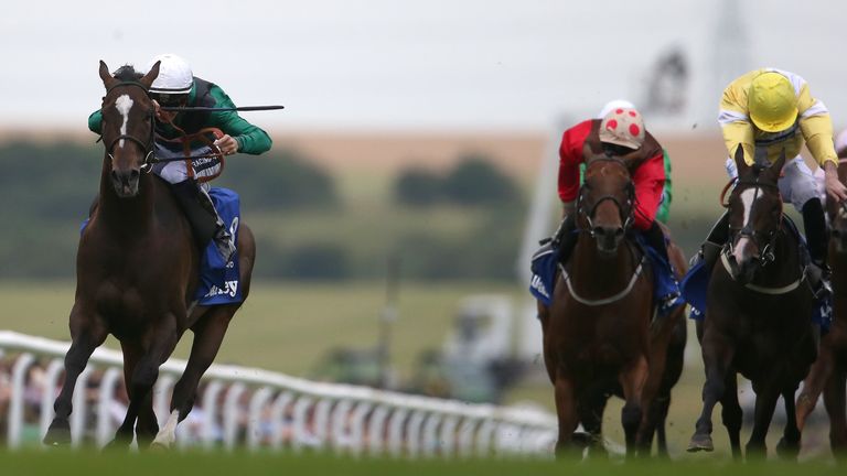 Harry Bentley riding Limato (left) drift badly right before winning the Darley July Cup at Newmarket 