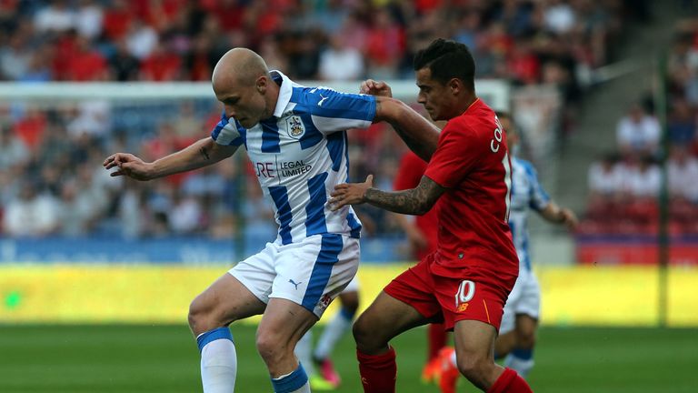 Aaron Mooy (L) of Huddersfield Town challenged by Philippe Coutinho of Liverpool during the  Pre-Season Friendly match 
