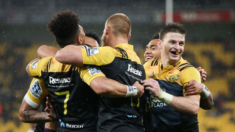 Brad Shields of the Hurricanes is congratulated by team-mates after scoring against the Sharks