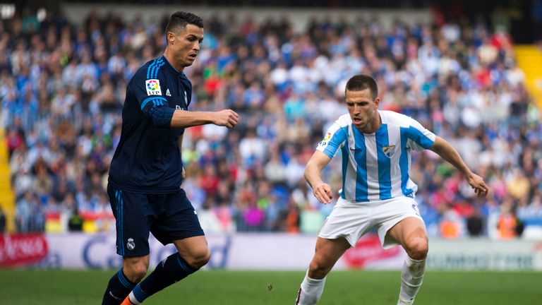 MALAGA, SPAIN - FEBRUARY 21: Cristiano Ronaldo (L) of Real Madrid CF Ignacio Camacho (R) of Malaga CF during the La Liga match between Malaga CF and Real M