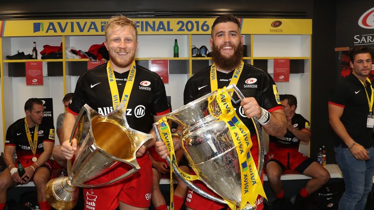 LONDON, ENGLAND - MAY 28:  Jackson Wray of Saracens and Will Fraser of Saracens celebrate their 'double' success with the European Cup and Premiership trop