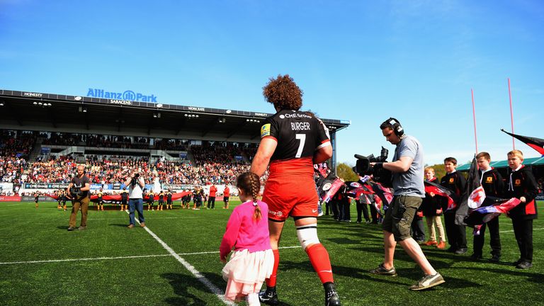 Jacques Burger of Saracens takes to the pitch with his children for his final match during the Aviva Premiership match between Saracens and Newcastle Falco