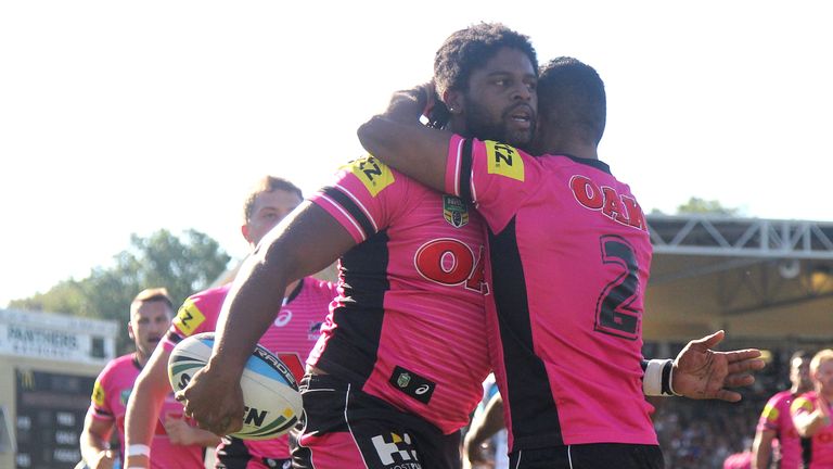 BATHURST, AUSTRALIA - MARCH 14:  Jamal Idris of the Panthers is congratulated by team mate George Jennings after scoring a try during the round two NRL mat