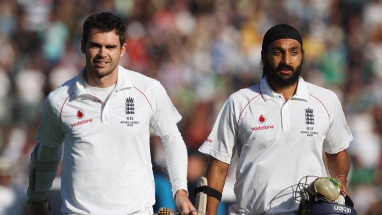 James Anderson and Monty Panesar of England walk off after securing the draw during day five of the first Ashes Test against Australia