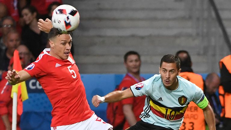 Belgium's forward Eden Hazard challenges Wales' defender James Chester 
