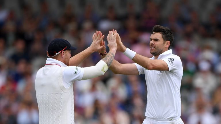 England bowler James Anderson celebrates with Ben Stokes (l) after dismissing Pakistan batsman Shan Masood during day three of the second Test