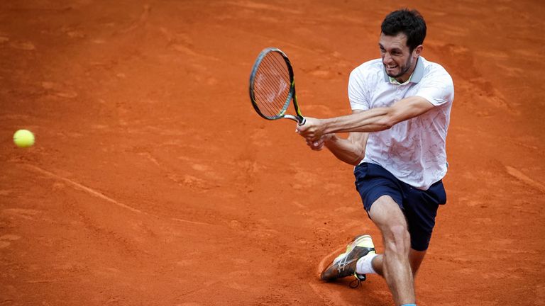 James Ward of Great Britain returns the ball to Dusan Lajovic of Serbia during the Davis Cup Quarter FinalJuly 2p