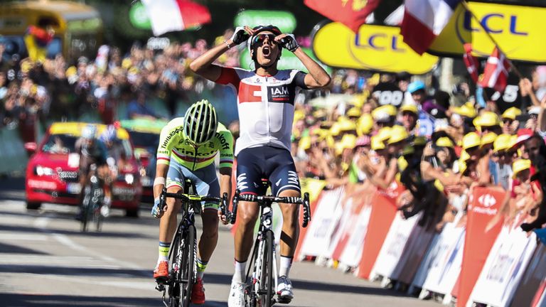 Jarlinson Pantano celebrates as he crosses the finish line ahead of Rafal Majka (L) at the end of the 160 km 15th stage of the Tour de France