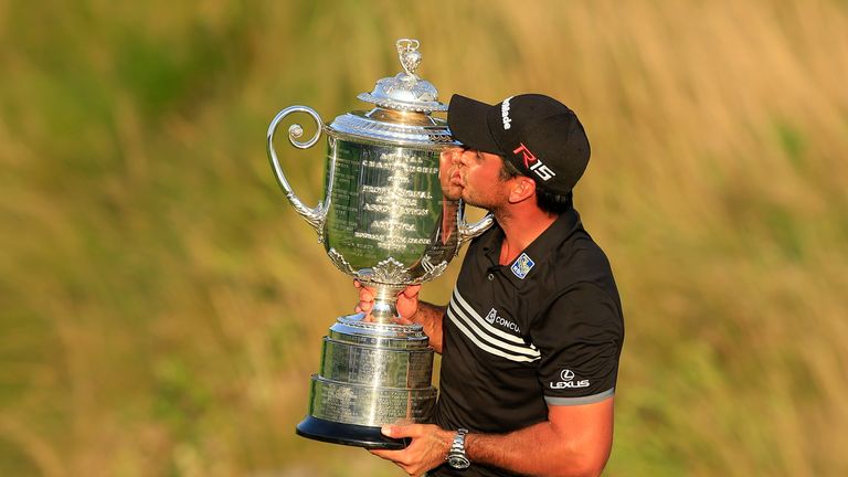 SHEBOYGAN, WI - AUGUST 16:  Jason Day of Australia proudly holds the Wanamaker Trophy after his victory with a record Major score of 20 under par during th