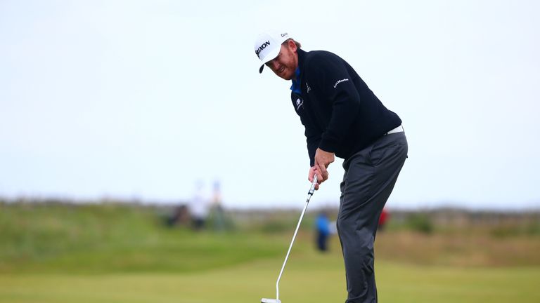 JB Holmes of the United States putts on the 1st during the final round on day four of the 145th Open at Royal Troon