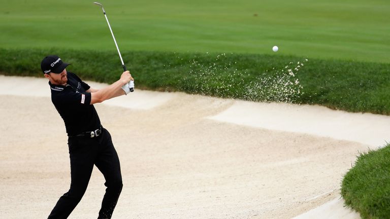 Turning point: Jimmy Walker holes from the sand for birdie at the 10th 