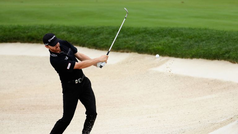 Jimmy Walker of the United States chips in for birdie from a greenside bunker on the tenth hole during the final round of the PGA Championship