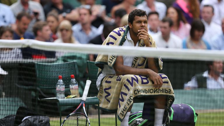 France's Jo-Wilfried Tsonga looks up during a break in play against Britain's Andy Murray during their men's singles quarter-final match on the tenth day o