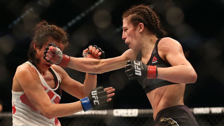 MELBOURNE, AUSTRALIA - NOVEMBER 15:  Joanna Jedrzejczyk of Poland (R) and Valerie Letourneau of Canada compete in their UFC women's strawweight championshi