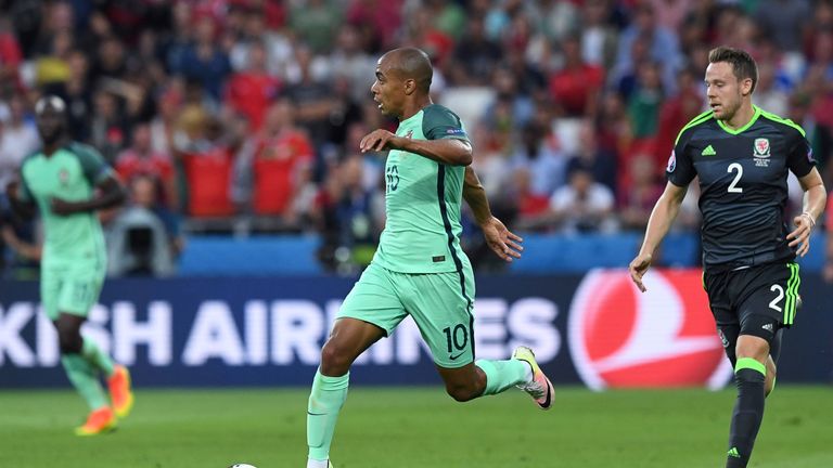 Portugal's midfielder Joao Mario (C) vies with Wales' defender Chris Gunter (R) during the Euro 2016 semi-final football match between Portugal and Wales a