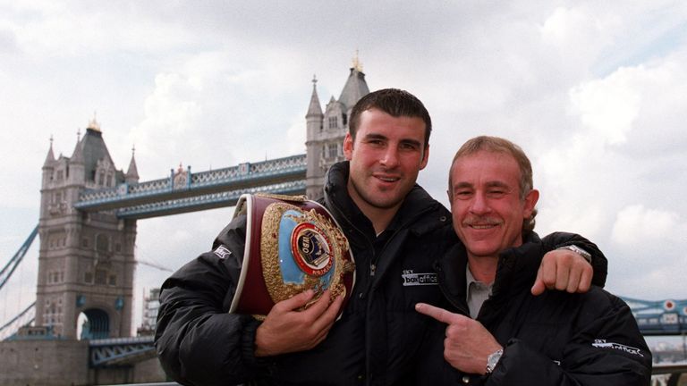 24 Sep 2001:  Joe Calzaghe of Wales poses with his manager Enzo Calzaghe in front of Tower Bridge during a press conference at the Tower Hill Thistle hotel