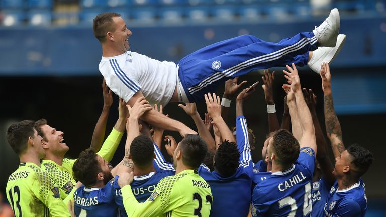John Terry of Chelsea is thrown into the air by team mates after the Barclays Premier League match between Chelsea and Leicester