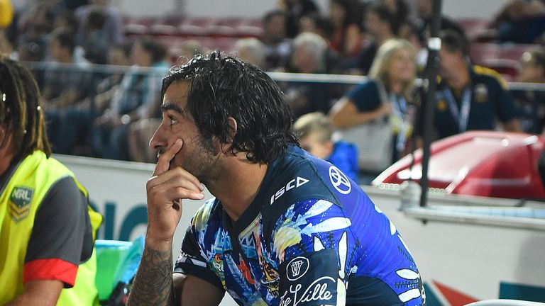  Johnathan Thurston of the Cowboys sits on the bench with ice strapped to his leg