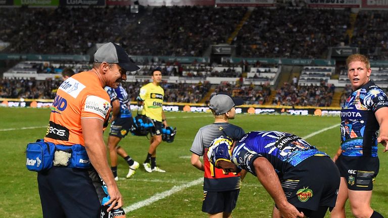 Johnathan Thurston of the Cowboys holds his leg after being injured during the round 20 NRL match between the Cowboys and Canterbury Bulldogs