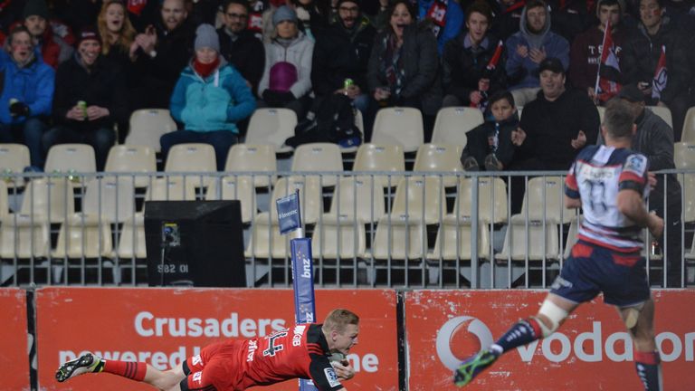 Johnny McNicholl of the Crusaders dives over to score