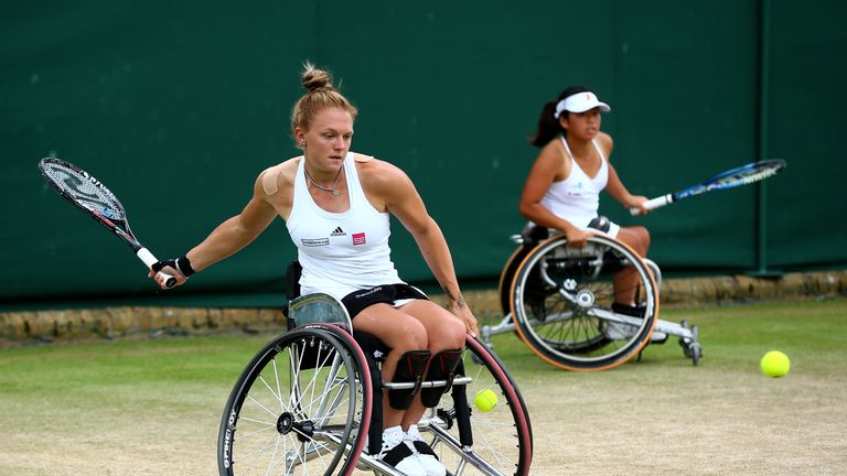 Jordanne Whiley of Great Britain (partner of Yui Kamiji of Japan) plays a forehand during the Ladies Doubles Wheelchair final at Wimbledon