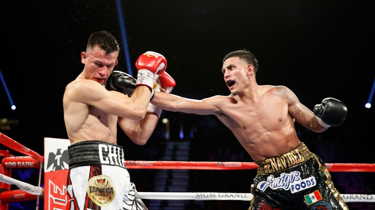 Jose Benavidez Jr. (R) lands a punch on Francisco Santana during their welterweight bout at the MGM Grand Garden Arena on July 23