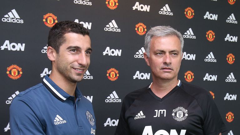Henrikh Mkhitaryan of Manchester United poses with Manager Jose Mourinho