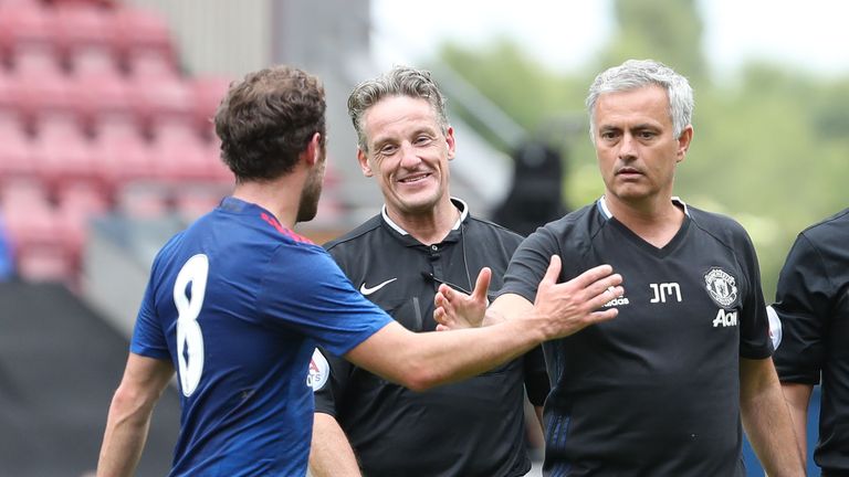 Manager Jose Mourinho of Manchester United congratulates Juan Mata