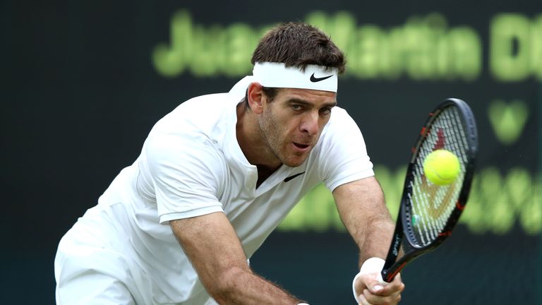LONDON, ENGLAND - JULY 01:  Juan Martin Del Potro of Argentina plays a backhand during the Men's Singles second round match against Stan Wawrinka of Switze