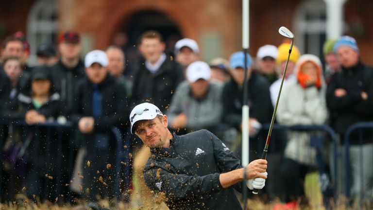 Justin Rose hits a bunker shot