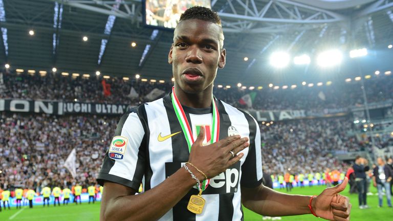Juventus' French midfielder Paul Pogba celebrates during the ceremony of the Scudetto, the Italian Serie A trophy after the Italian Serie A football match 