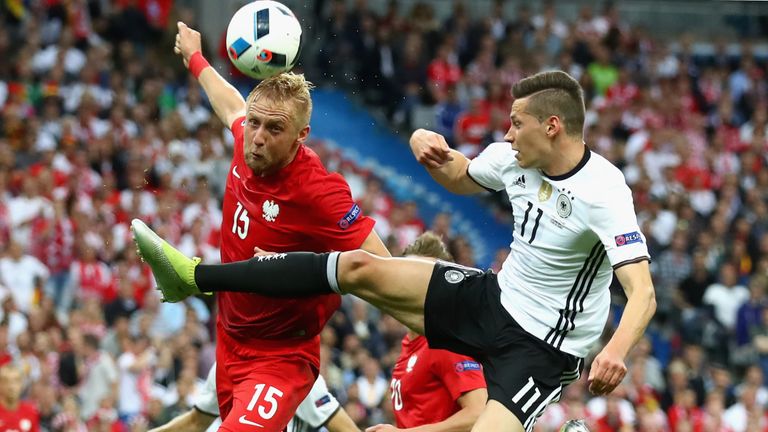 PARIS, FRANCE - JUNE 16:  Toni Kroos (R) of Germany battles for the ball with Kamil Glik during the UEFA EURO 2016 Group C match between Germany and Poland