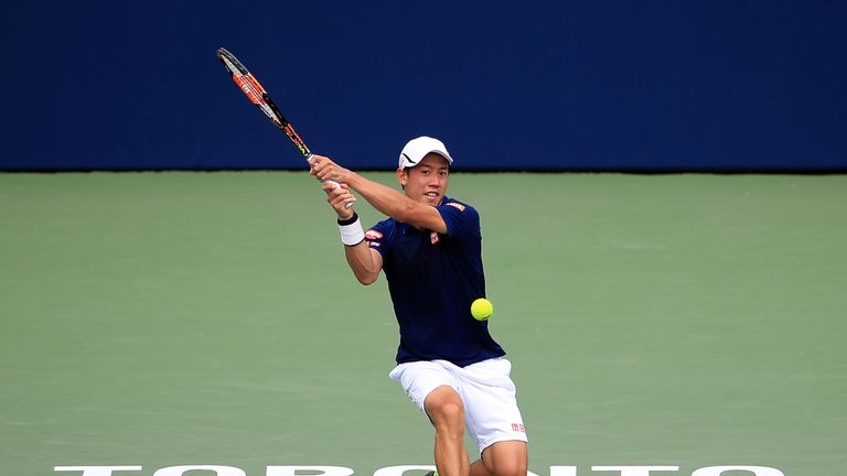 TORONTO, ON - JULY 28:  Kei Nishikori of Japan plays a shot against Rajeev Ram of the USA during Day 4 of the Rogers Cup at the Aviva Centre on July 28, 20