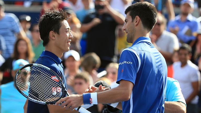 Novak Djokovic (r) is congratulated by Kei Nishikori