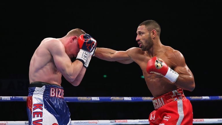 SHEFFIELD, ENGLAND - MARCH 26:  Kell Brook lands a right shot on Kevin Bizier during the IBF World Welterweight Championship between Kell Brook and Kevin B
