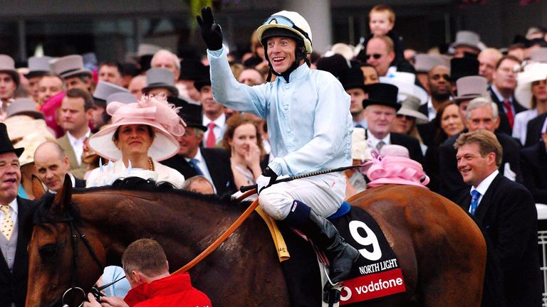 Jockey Kieren Fallon celebrates on North Light after winning the Vodaphone Derby Stakes at Epsom, Saturday June 5, 2004.