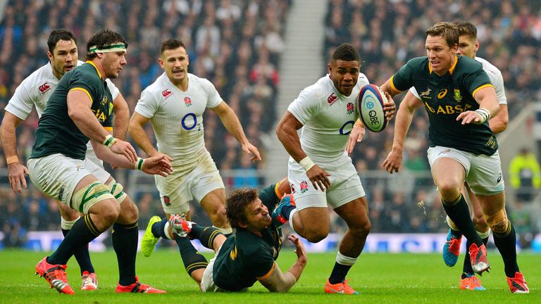 England's centre Kyle Eastmond (3rd R) runs at the South African defence during the Autumn International rugby union Test match between England and South A
