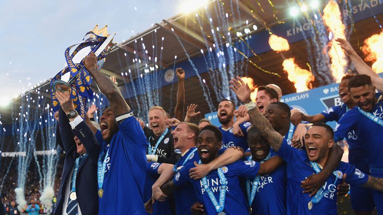 LEICESTER, ENGLAND - MAY 07:  Captain Wes Morgan and manager Claudio Ranieri of Leicester City lift the Premier League Trophy after the Barclays Premier Le
