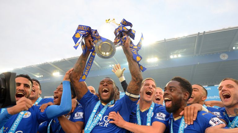 Leicester captain Wes Morgan lifts the Premier League trophy