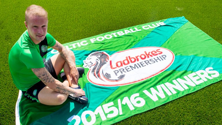 Celtic striker Leigh Griffiths with Scottish Premiership champions flag for 2015/16 season