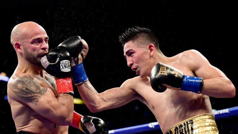 ANAHEIM, CA - FEBRUARY 27:  Leo Santa Cruz punches Kiko Martinez to a fifth round TKO to retain the WBA Featherweight Super title at Honda Center on Februa