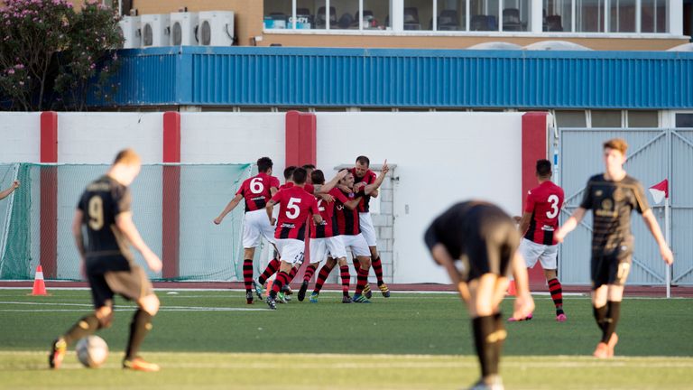 Lincoln's Lee Casciaro (second from right) celebrates as he opens the scoring