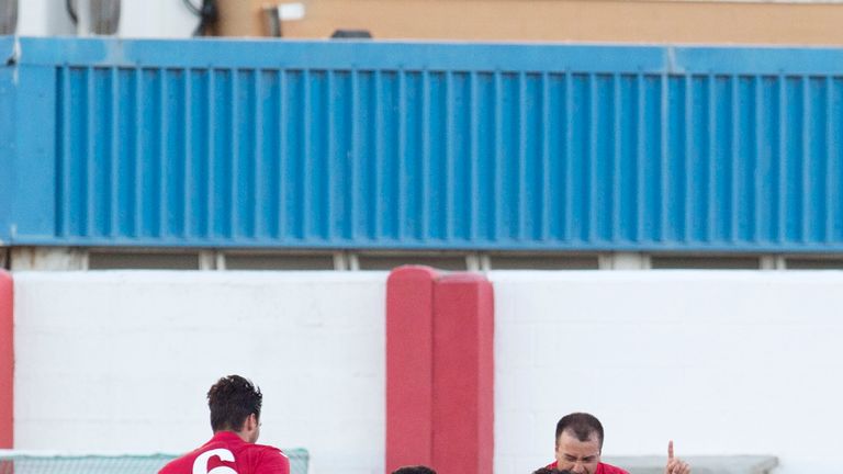 Lincoln's Lee Casciaro (second from right) celebrates as he opens the scoring