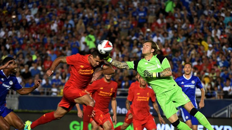 Liverpool goalkeeper Lorius Karius (R) clashes with Dejan Lovren 