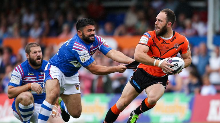 Castleford's Luke Gale is tackled by Wakefield's Jason Walton.