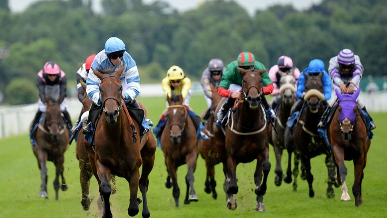 Magic Circle ridden by Jim Crowley (light blue cap) wins the John Smith's Stayers' Stakes during the John Smith's Cup Meeting at York Racecourse. PRESS ASS