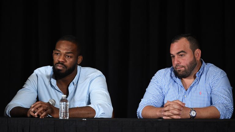 Jon Jones (L) and his manager Malki Kawa take questions during a news conference at MGM Grand Hotel & Casino