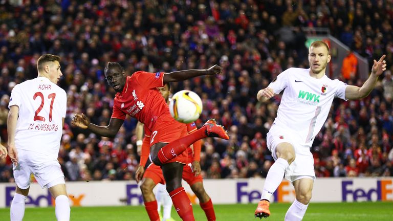 LIVERPOOL, ENGLAND - FEBRUARY 25:  Mamadou Sakho of Liverpool and Ragnar Klavan of Augsburg compete for the ball during the UEFA Europa League Round of 32 