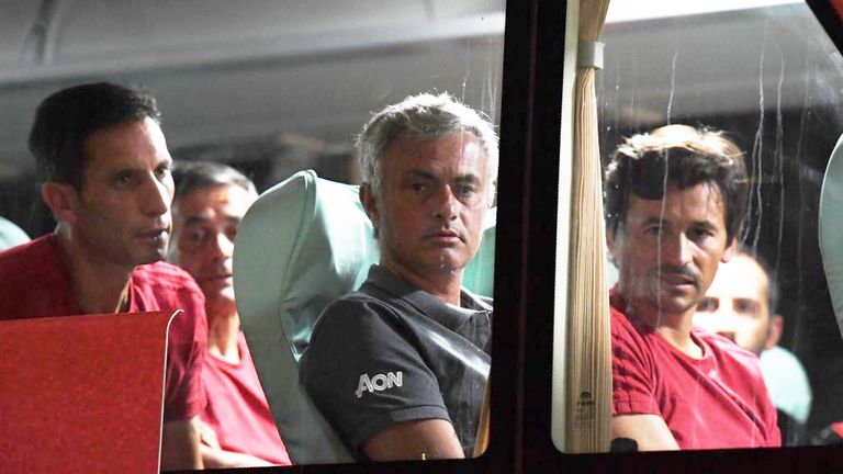 Manchester United coach Jose Mourinho (centre) looks out from the team bus